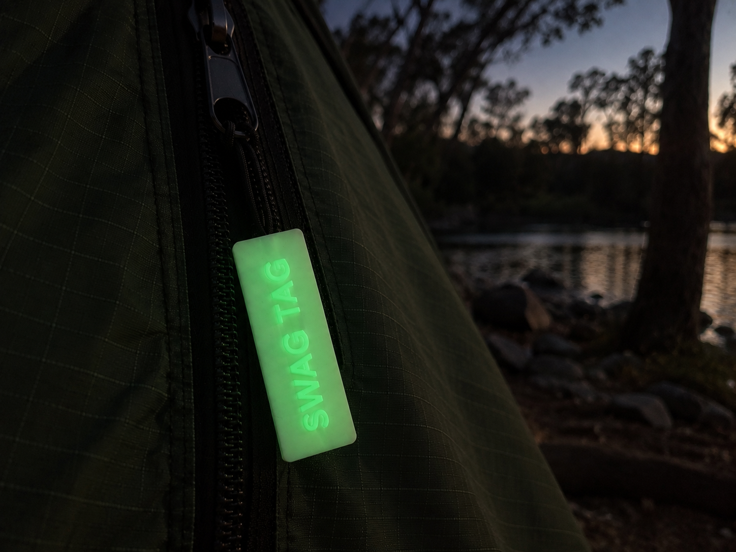 SwagTag glowing on camping gear at dusk
