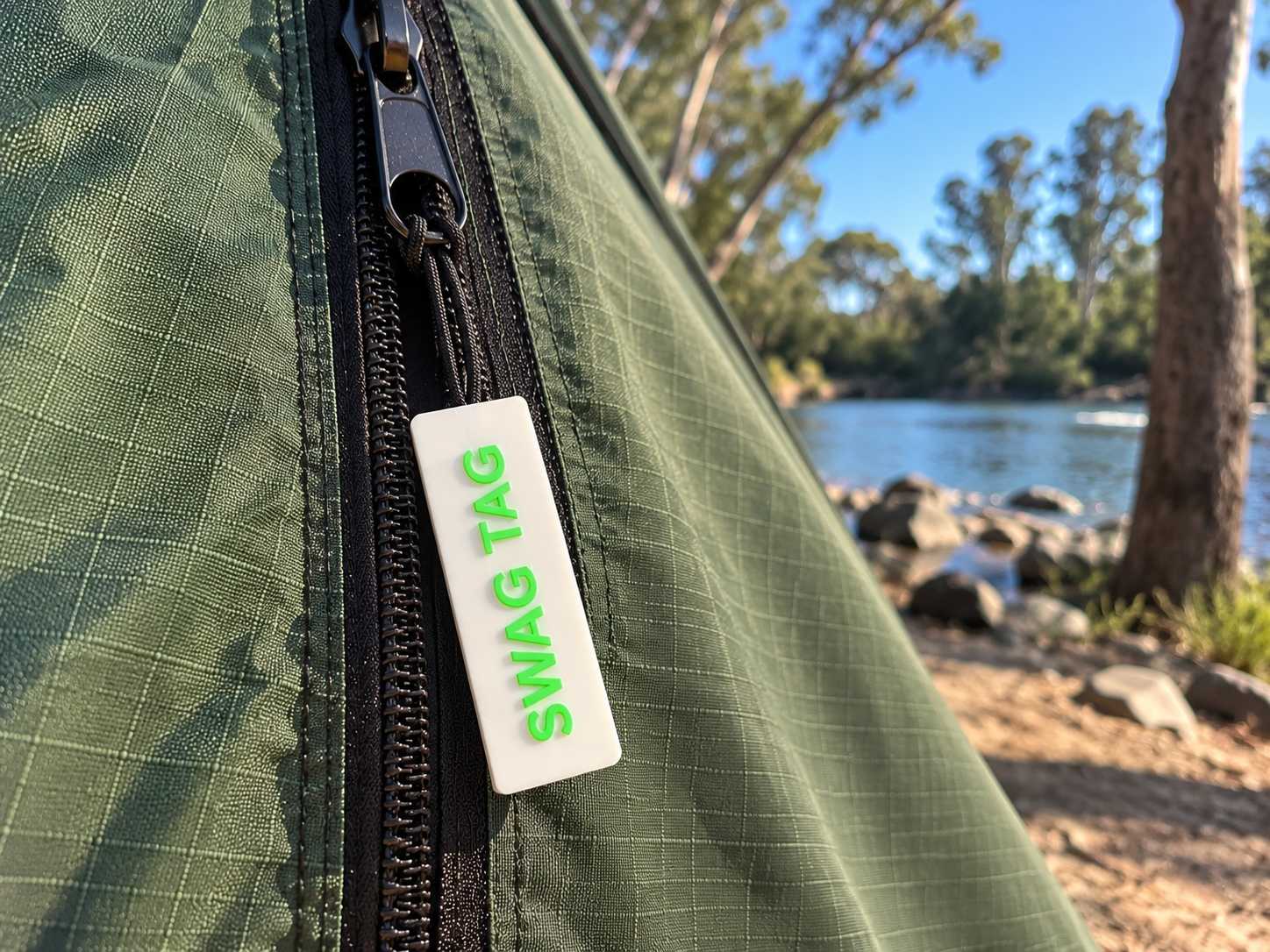 SwagTag on tent zipper at riverside campsite